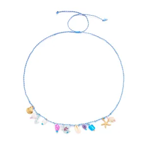 Detail of blue braided waist chain featuring seashell, starfish, and turtle charms.