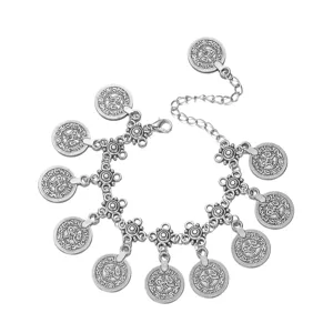 Detail view of Bohemian vintage silver coin pendants on a belly dance waist chain