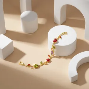 Exquisite detail of golden bracelet with colorful tulip and leaf shaped crystals