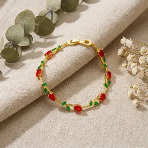 Exquisite detail shot of tulip flower bracelet featuring red petal gems and green leaves