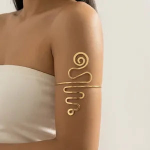 Golden spiral metal arm cuff featuring a geometric minimalist wire wrap design for women
