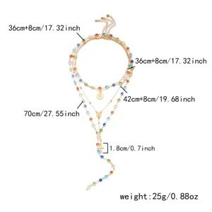 Detailed view of layered necklace with colorful rhinestones and cross pendant dimensions