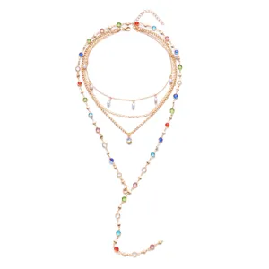 Detailed view of layered Y-shaped necklace with colorful stones and pearls