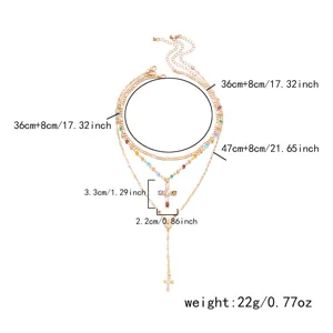 Detailed size diagram of a gold-layered necklace set with colorful rhinestone cross