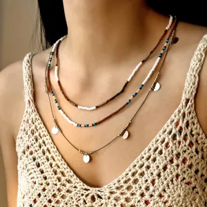 Multilayer rice bead necklace with round disc charms for women on summer model