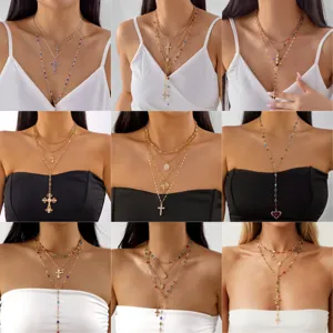 Detailed view of multiple layered cross necklace sets with colorful beads