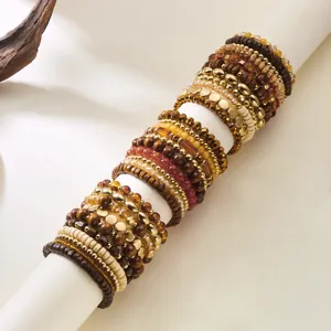Detailed view of a Bohemian beaded bracelet set with wood and metallic beads for stacking