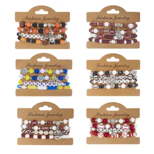 Detail view of assorted sports-themed beaded bracelet sets including basketball and soccer