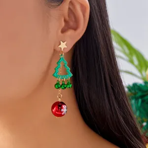 Close-up of a festive Christmas tree earring with green bells and a red snowflake ball.