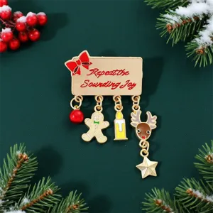 Close-up of Christmas enamel brooch with gingerbread man and reindeer pendants