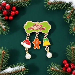 Detail view of festive Christmas enamel brooch with gingerbread man and bell charms