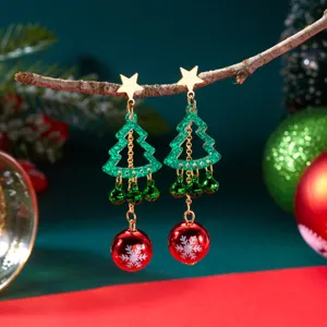 Festive Christmas tree earrings featuring green bells and snowflake red balls detail.