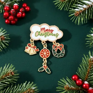 Detail view of a Christmas enamel brooch with Merry Christmas text and hanging charms