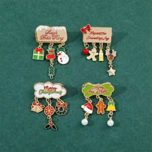 Collection of four festive Christmas enamel brooches with snowman and gingerbread man pendants