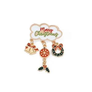 Detailed close-up of a festive Christmas brooch with colorful holiday dangle charms
