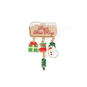 Detailed view of the Christmas alloy brooch featuring charms like a snowman and gift box
