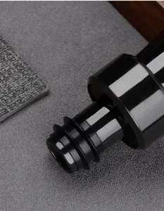 Close-up detail of the black glossy wine pourer spout and leak-proof silicone stopper.