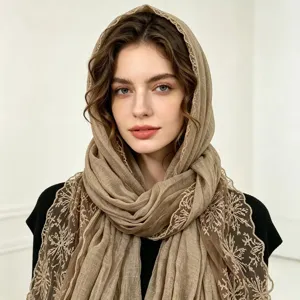 Detailed view of women's floral lace embroidered cotton linen scarf, elegant spring shawl.