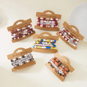 Detailed view of various ball sports themed polymer clay beaded bracelet sets for Game Day