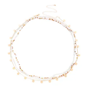 Detailed view of bohemian multi-layered waist chain featuring beads and gold sequins