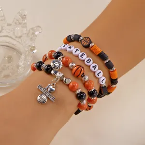 Close-up of sports themed beaded bracelets with I Love Basketball silver charms