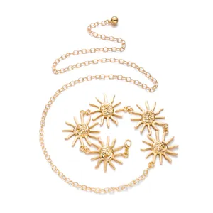 High-quality detailed view of vintage gold waist chain with engraved sun faces pendants
