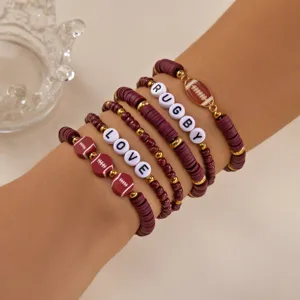 Detailed view of rugby-themed soft clay beaded bracelets with LOVE and RUGBY charms