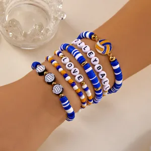 Close-up of a volleyball themed clay bead bracelet set with LOVE and VOLLEYBALL lettering
