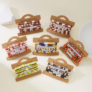 Detail of sports-themed clay bead bracelet sets including rugby and soccer designs