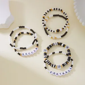 Detail of sports-themed beaded bracelet set with soccer and football letter beads