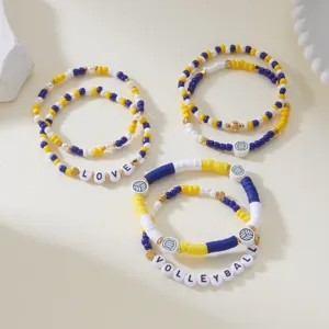 Detailed view of volleyball themed clay bead bracelets with LOVE and VOLLEYBALL text