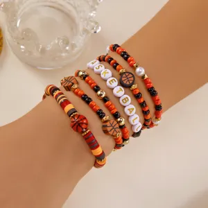 Detail of basketball themed beaded bracelet set for sport fans and game day outfits.
