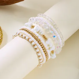 Elegant Bohemian multi-layer beaded bracelet set with iridescent white and gold beads