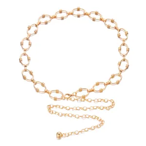 Detail shot of a vintage-style gold-toned metal chain belt featuring large oval link design