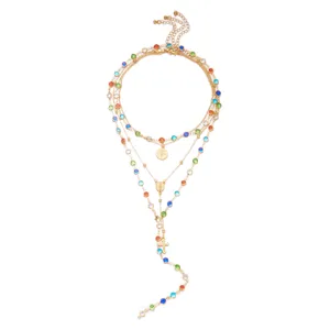 Layered gold chain necklace with multi-color rhinestones and cross pendant detail
