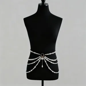 Close-up detail of multi-layered faux pearl body chain displayed on black mannequin