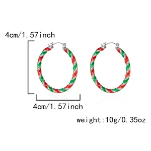 Detailed view of red and green Christmas twisted hoop earrings with 4cm diameter