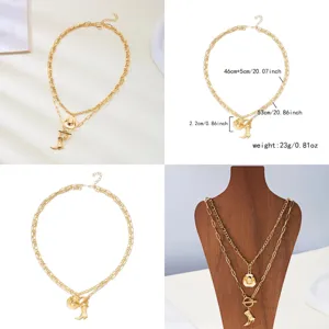 Western cowboy style double-layered gold necklace set with hat and boot pendants