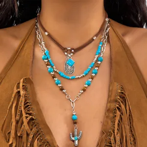 Detail view of multi-layer Western cowboy necklace set with turquoise and cactus pendant