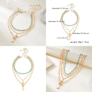 Layered Western cowboy necklace set with turquoise beads and gold charms