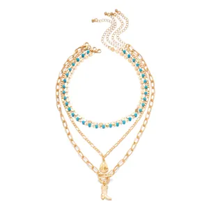 Multi-layer gold chain necklace with turquoise beads and cowboy hat boot pendants