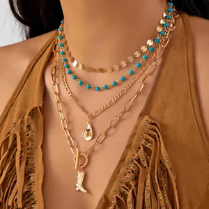 Bohemian western cowboy style layered necklace set with turquoise beads and gold-tone pendants