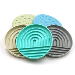 Macro view of colorful silicone pet lick mats with slow feeder texture and suction cups