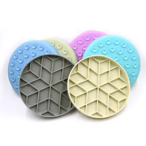 Detailed view of round silicone pet slow feeder pads with suction cups and patterns