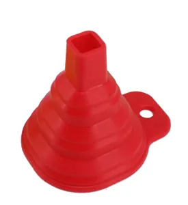 Red silicone collapsible funnel detail, flexible folding kitchen tool with hanging hole.