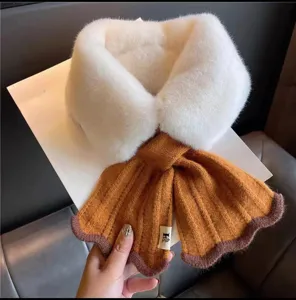 Cozy winter scarf featuring white faux fur upper collar and brown knitted fishtail lower part.