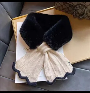 Korean style knitted faux fur crossover scarf with elegant scalloped tail design detail.