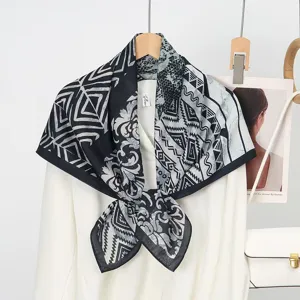 Classic black and white printed silk wool square scarf, elegant geometric pattern design for women.