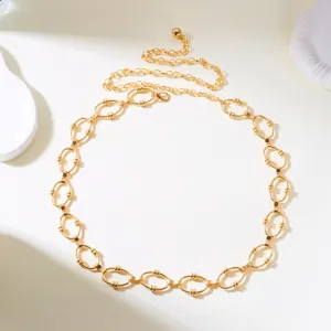 Detailed view of elegant gold-toned oval link waist chain with adjustable extender