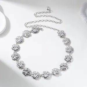 Detailed view of vintage silver floral engraved waist chain with adjustable extender links.